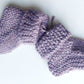 Handmade knitted baby socks in lila with folded ankle cuffs, made from 100% baby alpaca wool—soft, stretchy, and perfect for little feet.