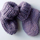 Handmade knitted baby socks in lila with folded ankle cuffs, made from 100% baby alpaca wool—soft, stretchy, and perfect for little feet.